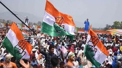 Congress supporters with Congress flags ahead of a rally. (File) Congress supporters with Congress flags ahead of a rally. (File)