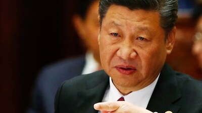 Chinese President Xi Jinping is seen. Regulatory scrutiny has increased in China, leading to stricter travel policies and layoffs, as the government aims to reshape the financial sector amid a sluggish economy. Chinese President Xi Jinping is seen. Regulatory scrutiny has increased in China, leading to stricter travel policies and layoffs, as the government aims to reshape the financial sector amid a sluggish economy.