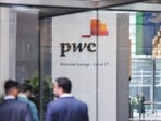 The PwC sign is seen in the lobby of their offices (Reuters)