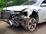 A police personnel near the damaged Audi owned by Maharashtra BJP chief Chandrashekhar Bawankule's son Sanket Bawankule.