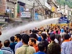 Mandi: Water cannons being used on agitators during a protest over alleged illegal construction at a mosque in Shimla, in Mandi, Friday, Sept. 13. Mandi: Water cannons being used on agitators during a protest over alleged illegal construction at a mosque in Shimla, in Mandi, Friday, Sept. 13.