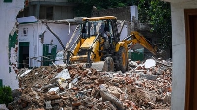A bulldozer demolishing a structure in Delhi. (Raj K Raj/HT photo) A bulldozer demolishing a structure in Delhi. (Raj K Raj/HT photo)