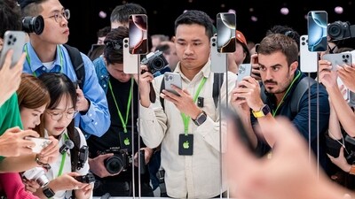 Attendees view new products during an event at Apple Park campus in Cupertino, California, US, on Monday, Sept. 9, 2024. Apple Inc. introduced the latest version of its flagship device, the iPhone 16, betting it can entice consumers with modest hardware upgrades and AI technology that's still on the horizon. Photographer: David Paul Morris/Bloomberg (Bloomberg)