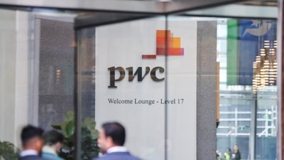 The PwC sign is seen in the lobby of their offices (Reuters)