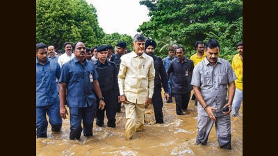 Andhra Pradesh CM N Chandrababu Naidu inspects a flood-hit area in Vijayawada on September 2. (PTI) Andhra Pradesh CM N Chandrababu Naidu inspects a flood-hit area in Vijayawada on September 2. (PTI)