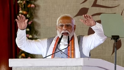 Prime Minister Narendra Modi gestures during the Kisan Samman Sammelan (farmer's honour conference) on the outskirts of Varanasi on June 18, 2024. (Photo by Niharika KULKARNI / AFP) (AFP) Prime Minister Narendra Modi gestures during the Kisan Samman Sammelan (farmer's honour conference) on the outskirts of Varanasi on June 18, 2024. (Photo by Niharika KULKARNI / AFP) (AFP)