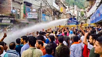 Mandi: Water cannons being used on agitators during a protest over alleged illegal construction at a mosque in Shimla, in Mandi, Friday, Sept. 13. (PTI) Mandi: Water cannons being used on agitators during a protest over alleged illegal construction at a mosque in Shimla, in Mandi, Friday, Sept. 13. (PTI)