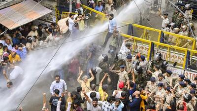 Police using water cannons to disperse protesters demanding the demolition of a mosque allegedly built on encroached land in Mandi on Friday. (PTI Photo) Police using water cannons to disperse protesters demanding the demolition of a mosque allegedly built on encroached land in Mandi on Friday. (PTI Photo)