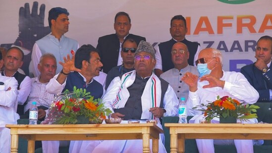 Congress President Mallikarjun Kharge with party leader Ghulam Ahmad Mir and Jammu and Kashmir National Conference (JKNC) President Farooq Abdullah during a public meeting for Jammu and Kashmir Assembly elections, in Anantnag. (PTI)