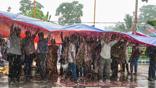 Kolkata rape-murder case highlights: Agitators take cover during rains as junior doctors continue their 'cease work' and sit-in demonstration against the RG Kar Hospital incident, outside Swasthya Bhavan in Kolkata, Friday, Sept. 13. (PTI Photo/Swapan Mahapatra) Kolkata rape-murder case highlights: Agitators take cover during rains as junior doctors continue their 'cease work' and sit-in demonstration against the RG Kar Hospital incident, outside Swasthya Bhavan in Kolkata, Friday, Sept. 13. (PTI Photo/Swapan Mahapatra)