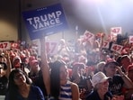LAS VEGAS, NEVADA - SEPTEMBER 13: Supporters of Republican presidential nominee, former U.S. President Donald Trump, hold signs during a campaign rally at The Expo at World Market Center Las Vegas on September 13, 2024 in Las Vegas, Nevada. With 53 days before election day, Former President Trump continues to campaign. Justin Sullivan/Getty Images/AFP (Photo by JUSTIN SULLIVAN / GETTY IMAGES NORTH AMERICA / Getty Images via AFP) LAS VEGAS, NEVADA - SEPTEMBER 13: Supporters of Republican presidential nominee, former U.S. President Donald Trump, hold signs during a campaign rally at The Expo at World Market Center Las Vegas on September 13, 2024 in Las Vegas, Nevada. With 53 days before election day, Former President Trump continues to campaign. Justin Sullivan/Getty Images/AFP (Photo by JUSTIN SULLIVAN / GETTY IMAGES NORTH AMERICA / Getty Images via AFP)