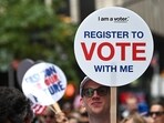 NEW YORK, NEW YORK - SEPTEMBER 06: An attendee holds a "Register to Vote" sign at Fashion For Our Future March on September 06, 2024 in Herald Square, New York City. Steven Ferdman/Getty Images/AFP (Photo by Steven Ferdman / GETTY IMAGES NORTH AMERICA / Getty Images via AFP) NEW YORK, NEW YORK - SEPTEMBER 06: An attendee holds a "Register to Vote" sign at Fashion For Our Future March on September 06, 2024 in Herald Square, New York City. Steven Ferdman/Getty Images/AFP (Photo by Steven Ferdman / GETTY IMAGES NORTH AMERICA / Getty Images via AFP)