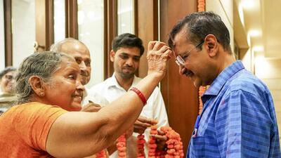 Delhi chief minister Arvind Kejriwal being received by his parents as he arrives at his residence after being released from Tihar Jail on bail on Friday. (PTI) Delhi chief minister Arvind Kejriwal being received by his parents as he arrives at his residence after being released from Tihar Jail on bail on Friday. (PTI)