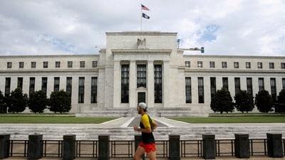 FILE PHOTO: A jogger runs past the Federal Reserve building in Washington, DC, U.S., August 22, 2018. REUTERS/Chris Wattie/File Photo (REUTERS)