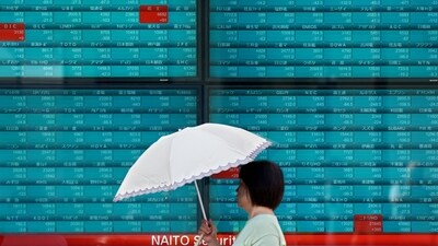 A woman walks in front of an electronic quotation board displaying stock prices of Nikkei 225 on the Tokyo Stock Exchange in Tokyo on September 4, 2024. Japan's key Nikkei index dropped more than three percent on September 4, weighed down by falls on Wall Street following lacklustre manufacturing data. (Photo by Kazuhiro NOGI / AFP) (AFP) A woman walks in front of an electronic quotation board displaying stock prices of Nikkei 225 on the Tokyo Stock Exchange in Tokyo on September 4, 2024. Japan's key Nikkei index dropped more than three percent on September 4, weighed down by falls on Wall Street following lacklustre manufacturing data. (Photo by Kazuhiro NOGI / AFP) (AFP)