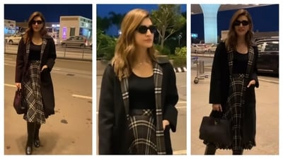 Kriti Sanon's airport look radiated a ‘dark academia’ vibe. She wore a black long overcoat with a plaid inner lining. Her midi skirt also had the same plaid pattern which complemented the blazer and skirt pairing really well. Completing the look with knee-high boots, sunglasses, and a leather bag, her outfit radiated a mysterious, chic vibe. (Instagram/@varindertchawla) Kriti Sanon's airport look radiated a ‘dark academia’ vibe. She wore a black long overcoat with a plaid inner lining. Her midi skirt also had the same plaid pattern which complemented the blazer and skirt pairing really well. Completing the look with knee-high boots, sunglasses, and a leather bag, her outfit radiated a mysterious, chic vibe. (Instagram/@varindertchawla)