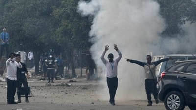 Police fire tear gas shell to disperse the protesters during a protest march in Manipur’s Imphal on September 10. (REUTERS) Police fire tear gas shell to disperse the protesters during a protest march in Manipur’s Imphal on September 10. (REUTERS)