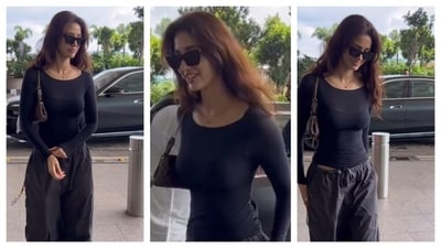 Disha Patani's airport look raised the temperature for sure. She stunned in a simple, form-fitting top with long-sleeves, that hugged her curves gracefully. She wore a black cargo pants that further enhanced the casual, chic look. (Instagram/@varindertchawla) Disha Patani's airport look raised the temperature for sure. She stunned in a simple, form-fitting top with long-sleeves, that hugged her curves gracefully. She wore a black cargo pants that further enhanced the casual, chic look. (Instagram/@varindertchawla)