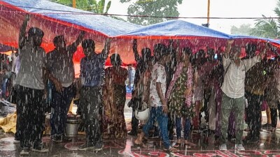 Agitators take cover during rain as junior doctors continued their 'cease work' and sit-in demonstration against the RG Kar Hospital incident outside Swasthya Bhavan in Kolkata. (PTI) Agitators take cover during rain as junior doctors continued their 'cease work' and sit-in demonstration against the RG Kar Hospital incident outside Swasthya Bhavan in Kolkata. (PTI)