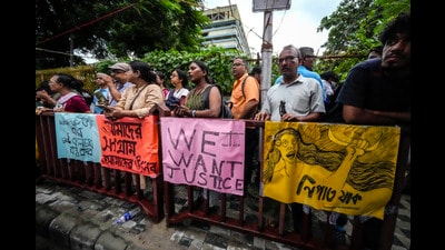 Sympathisers stand by the posters of an ongoing protest rally by the Junior Doctors Forum demanding justice against the rape and murder of a resident doctor at a government hospital in early August, in Kolkata, India, Friday, Sept. 13, 2024. (AP Photo/Bikas Das) (AP) Sympathisers stand by the posters of an ongoing protest rally by the Junior Doctors Forum demanding justice against the rape and murder of a resident doctor at a government hospital in early August, in Kolkata, India, Friday, Sept. 13, 2024. (AP Photo/Bikas Das) (AP)