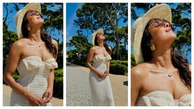 Priyanka Chopra looked like a summer dream in a figure-hugging, strapless crochet dress with bow-shaped designs near the bust. Wearing a straw hat, her ensemble exuded a light feminine aesthetic with a touch of bohemian vibe. The dainty minimalistic necklace, golden earrings, sunglasses, and rose-tinted lips completed the perfect vacation look. (Instagram/@priyankachopra) Priyanka Chopra looked like a summer dream in a figure-hugging, strapless crochet dress with bow-shaped designs near the bust. Wearing a straw hat, her ensemble exuded a light feminine aesthetic with a touch of bohemian vibe. The dainty minimalistic necklace, golden earrings, sunglasses, and rose-tinted lips completed the perfect vacation look. (Instagram/@priyankachopra)