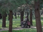 A person on a wheel chair at a park in Beijing, China, on Saturday, Sept. 14, 2024. China will raise the retirement age for the first time since 1978, a move likely to slow a decline in the labor force and support the economy. Photographer: Na Bian/Bloomberg
