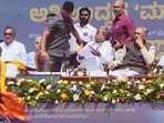 Security breach at International Day of Democracy event as an unidentified person approaches Karnataka Chief Minister Siddaramaiah's chair, in Bengaluru.