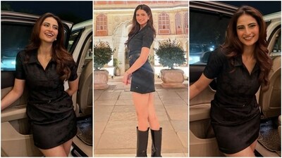 Palak Tiwari slays in her latest look, rocking a black mini dress with a collared neckline and waist belt. Paired with thigh-high boots and stud earrings, she exudes effortless style. (Instagram) Palak Tiwari slays in her latest look, rocking a black mini dress with a collared neckline and waist belt. Paired with thigh-high boots and stud earrings, she exudes effortless style. (Instagram)