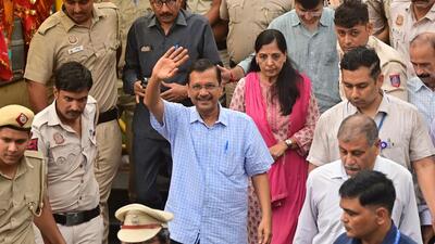 Arvind Kejriwal, along with his wife, on Sunday. (RAJ K RAJ /HT PHOTO)