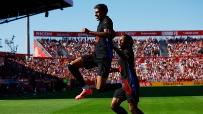 FC Barcelona's Lamine Yamal celebrates scoring their first goal with Jules Kounde. (REUTERS)