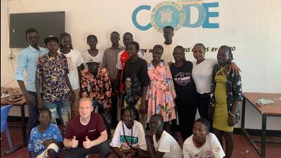 Latvian trainer and team captain, Sergejs Klimakovs, with members of the Refugee team that awaits visas to travel to Budapest for the chess Olympiad. (Sergejs Klimakovs)
