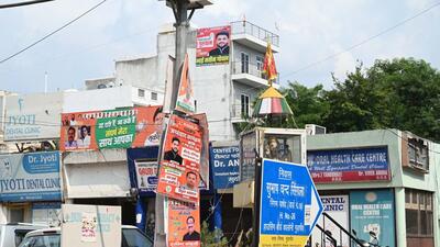Posters of candidates preparing to contest the assembly elections hang on an electricity pole at Patel Naga as of August 2024. (Parveen Kumar/HT Photo) Posters of candidates preparing to contest the assembly elections hang on an electricity pole at Patel Naga as of August 2024. (Parveen Kumar/HT Photo)