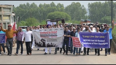 Residents holding a protest march, demanding urgent road safety measures in Mullanpur. (Keshav Singh/HT) Residents holding a protest march, demanding urgent road safety measures in Mullanpur. (Keshav Singh/HT)