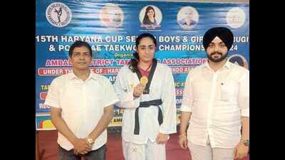 Rishita Dang, a native of Karnal and student at Christ University, Ghaziabad, won the gold medal at the 15th Haryana Cup Senior Boys and Girls Kyorugi and Poomsae Taekwondo Championship 2024 held at Ambala Cantt. (HT Photo)