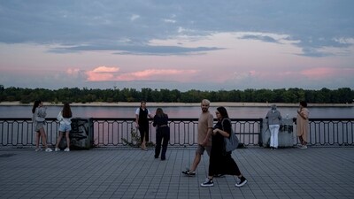 People walk along the embankment of Dnipro river in the city center of Kyiv, Ukraine, Friday Sept. 13, 2024. (AP Photo/Evgeniy Maloletka) (AP) People walk along the embankment of Dnipro river in the city center of Kyiv, Ukraine, Friday Sept. 13, 2024. (AP Photo/Evgeniy Maloletka) (AP)
