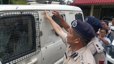Senior police officers inspecting bullet marks on a police vehicle allegedly fired by armed miscreants among protestors. Senior police officers inspecting bullet marks on a police vehicle allegedly fired by armed miscreants among protestors.