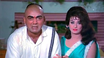 Mehmood and Saira Banu in a still from Padosan. Mehmood and Saira Banu in a still from Padosan.
