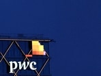 The logo of PwC is seen. PwC has announced investments in its China operations after receiving a record fine linked to its audit of Evergrande. The firm is implementing a remediation strategy, emphasizing staff support and leadership changes to ensure long-term sustainability and quality.
