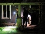 Secret Service and Homeland Security agents check a former home of a suspect named by news organisations as Ryan W. Routh as the FBI investigates what they said was an apparent assassination attempt in Florida on Republican presidential nominee and former U.S. President Donald Trump,
