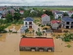 This aerial picture shows flood waters surrounding homes in Thai Nguyen province, in the aftermath of Typhoon Yagi hitting northern Vietnam. This aerial picture shows flood waters surrounding homes in Thai Nguyen province, in the aftermath of Typhoon Yagi hitting northern Vietnam.