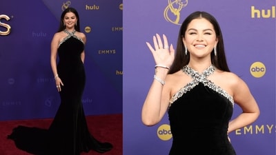 Selena Gomez arrived at the Emmy Awards in a stunning black floor-sweeping gown with a silver embellished halter neckline, owning the red carpet like a true diva. (Reuters) Selena Gomez arrived at the Emmy Awards in a stunning black floor-sweeping gown with a silver embellished halter neckline, owning the red carpet like a true diva. (Reuters)