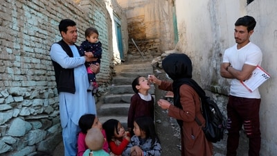 Shabana Maani, gives a polio vaccination to a child in the old part of Kabul, Afghanistan, Monday, March 29, 2021. (AP Photo/Rahmat Gul, File) (AP) Shabana Maani, gives a polio vaccination to a child in the old part of Kabul, Afghanistan, Monday, March 29, 2021. (AP Photo/Rahmat Gul, File) (AP)