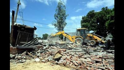 Ayodhya: A bulldozer being used to demolish the bakery of Moid Khan who is accused of allegedly raping a 12-year-old girl, in Ayodhya, Saturday, Aug. 3, 2024. (PTI Photo) (PTI) Ayodhya: A bulldozer being used to demolish the bakery of Moid Khan who is accused of allegedly raping a 12-year-old girl, in Ayodhya, Saturday, Aug. 3, 2024. (PTI Photo) (PTI)