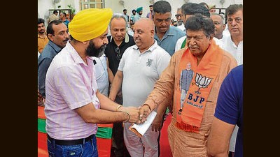 BJP candidate Gian Chand Gupta campaigning in Panchkula constituency on Monday. (Sant Arora/HT) BJP candidate Gian Chand Gupta campaigning in Panchkula constituency on Monday. (Sant Arora/HT)