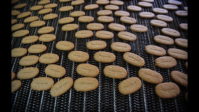 FILE PHOTO: Biscuits pass along a conveyor belt after being baked at the Britannia factory in New Delhi June 3, 2011. The company manufactures and sells biscuits, bread, rusk, cakes and dairy products. REUTERS/Adnan Abidi (REUTERS) FILE PHOTO: Biscuits pass along a conveyor belt after being baked at the Britannia factory in New Delhi June 3, 2011. The company manufactures and sells biscuits, bread, rusk, cakes and dairy products. REUTERS/Adnan Abidi (REUTERS)
