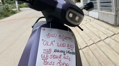 Nisha Gowri, an Ola customer in Bengaluru, attached a placard to her malfunctioning e-scooter, warning others against the purchase. Her online post received significant attention, highlighting dissatisfaction with Ola's product quality amid reports of other customers facing similar issues. Nisha Gowri, an Ola customer in Bengaluru, attached a placard to her malfunctioning e-scooter, warning others against the purchase. Her online post received significant attention, highlighting dissatisfaction with Ola's product quality amid reports of other customers facing similar issues.