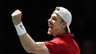 Canada's Denis Shapovalov celebrates winning his singles match against Britain's Daniel Evans (Action Images via Reuters)