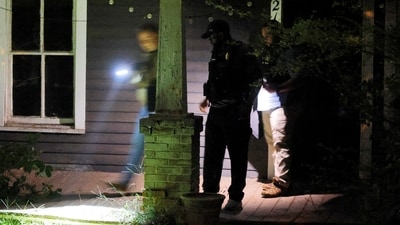 Secret Service and Homeland Security agents check a former home of a suspect named by news organisations as Ryan W. Routh as the FBI investigates what they said was an apparent assassination attempt in Florida on Republican presidential nominee and former U.S. President Donald Trump, (REUTERS)
