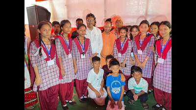 Uttar Pradesh Chief Minister Yogi Adityanath poses for photo with students during inauguration of the Sidheshwari Mandir at Barkathal in West Tripura, Monday. (PTI) Uttar Pradesh Chief Minister Yogi Adityanath poses for photo with students during inauguration of the Sidheshwari Mandir at Barkathal in West Tripura, Monday. (PTI)