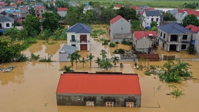 This aerial picture shows flood waters surrounding homes in Thai Nguyen province, in the aftermath of Typhoon Yagi hitting northern Vietnam. (AFP)